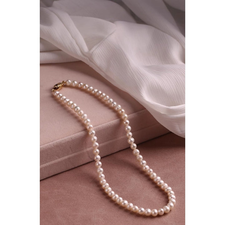 Natural freshwater pearl necklace featuring 10mm round pearls and a silver yuanbao clasp, styled in a full circle on a white background.
