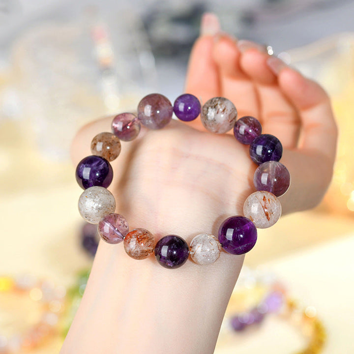 Woman wearing Natural Amethyst and Super Seven Purple Galaxy Bracelet for calming energy and meditation style