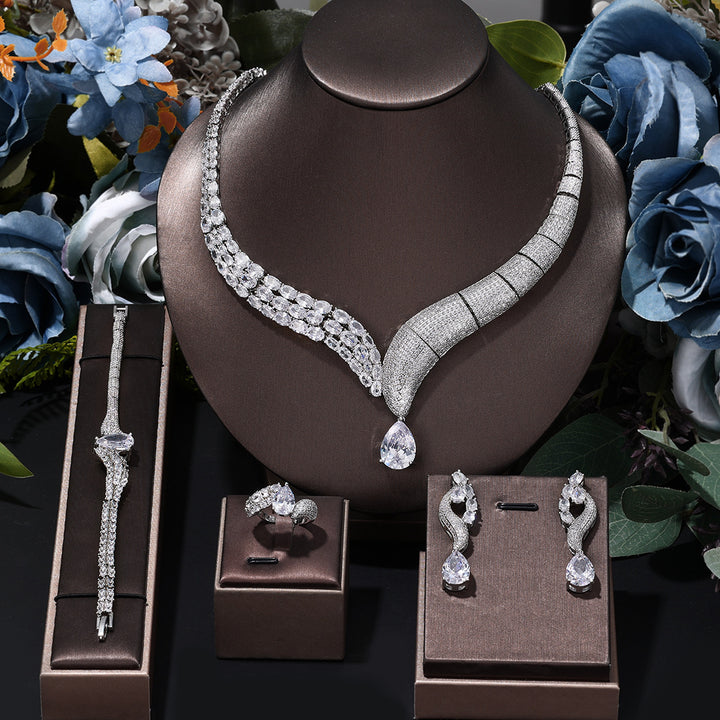 Luxury 4-piece bridal jewelry set in green and silver with 3A cubic zirconia stones â€?necklace, earrings, ring, and bracelet
