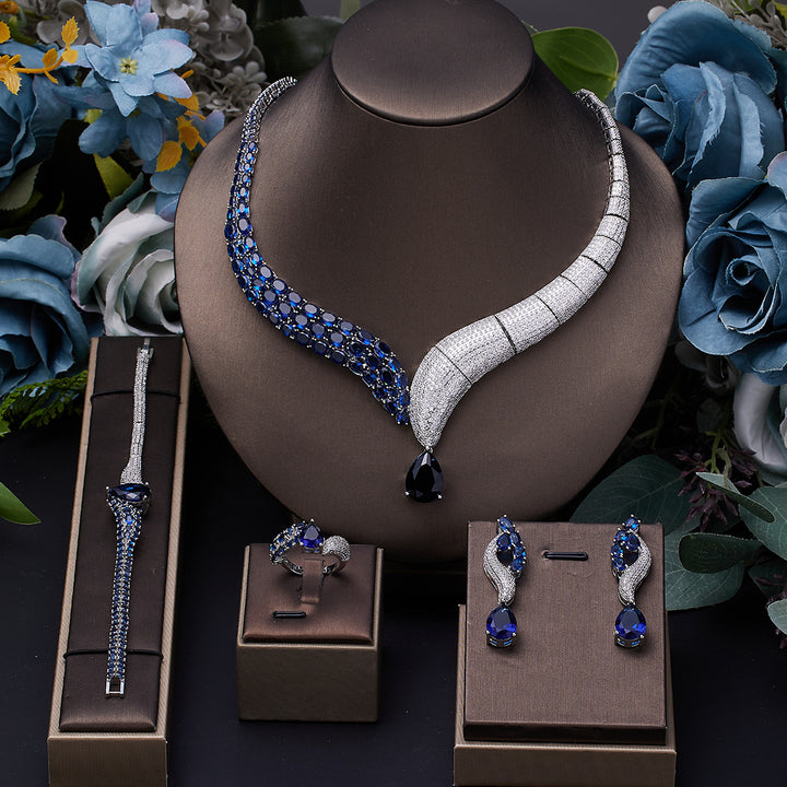 Luxury 4-piece bridal jewelry set in green and silver with 3A cubic zirconia stones â€?necklace, earrings, ring, and bracelet